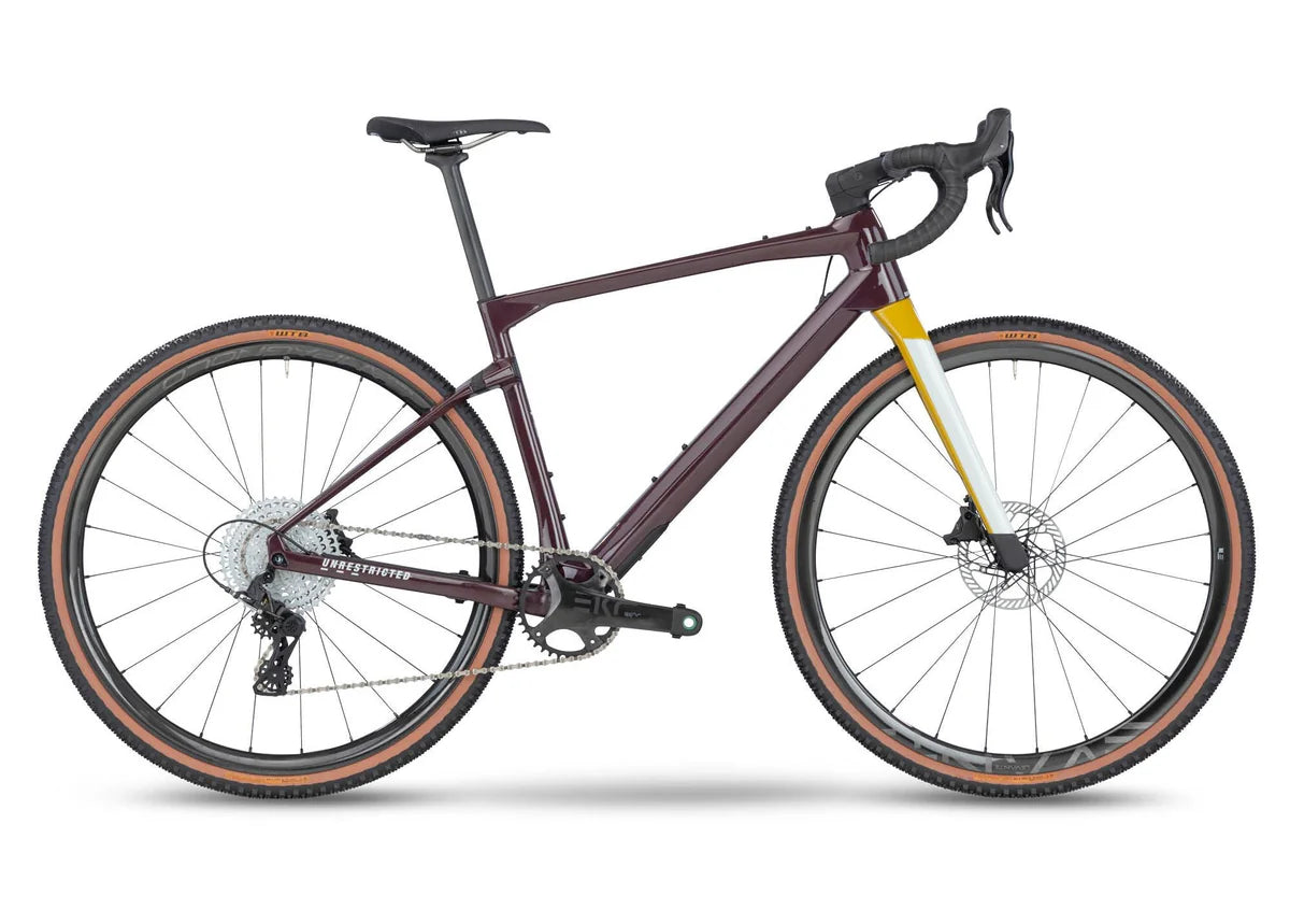 Bicycle with a maroon frame and black components on a white background
